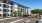 parking lot with tropical landscaping